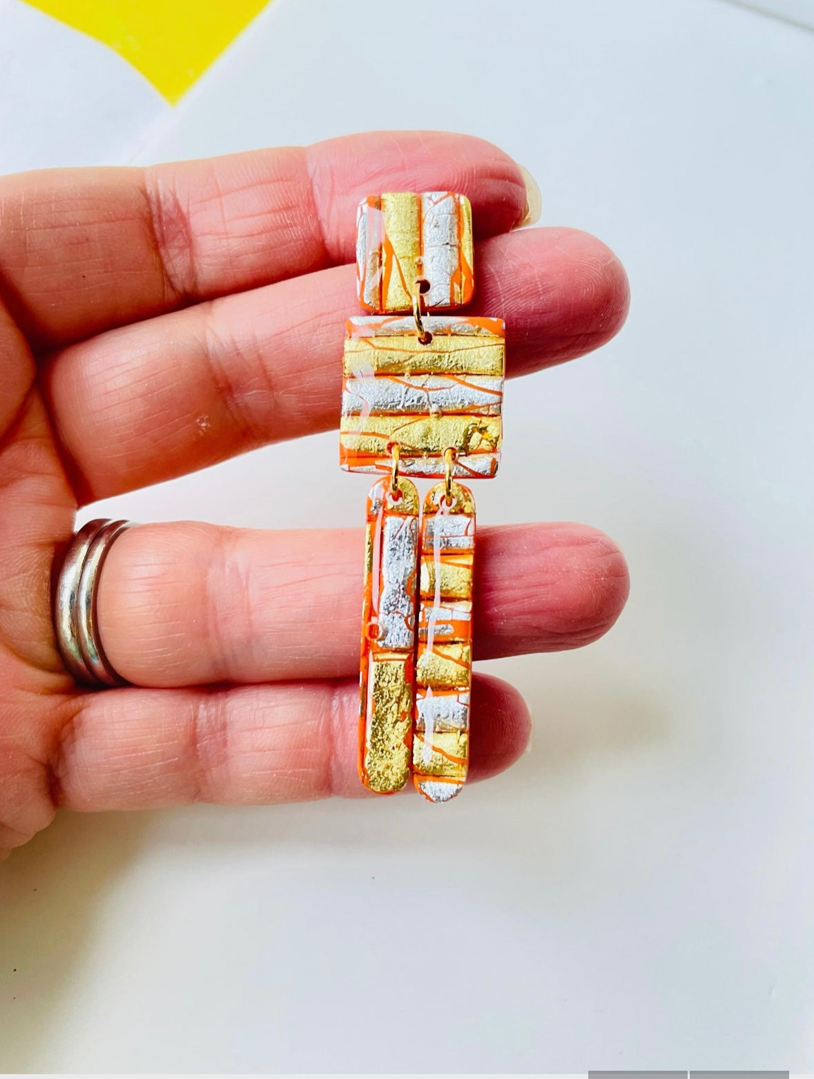 These striking earrings are a true statement piece to express summer fun. Featuring a mix of orange, gold, and silver, they add an opulent touch to elevate any outfit. Wear them under the sun and enjoys the shimmering sparkles created with each move.

These earrings are totally handmade by me and each piece is slightly different.
MySaraJewellery
