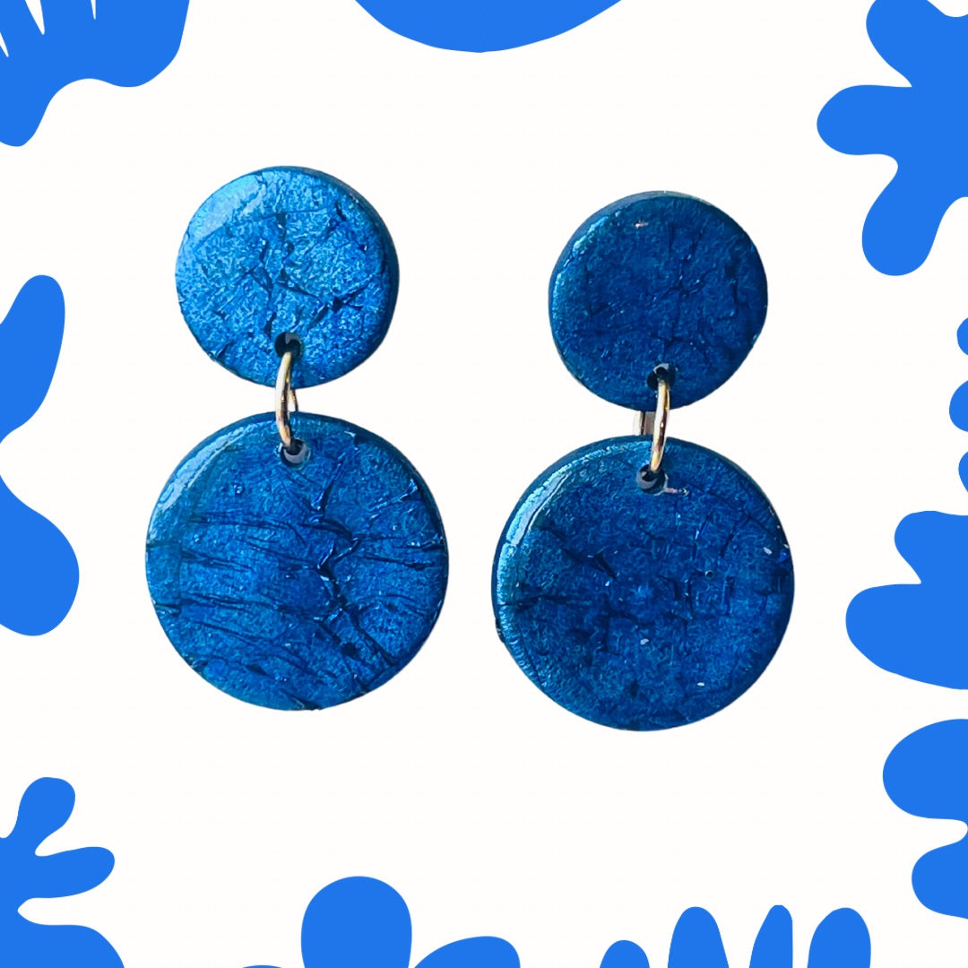 These blue earrings are perfect to bring a touch of sparkle to your day. Perfect for a small gift they are a versatile accessory to suit any style. Looking for unique gifts? Whether for mum or a good friend these handmade polymer clay Golden earrings would be ideal.

Make a statement with our exquisite, handmade earrings – the perfect blend of fashion and fun! Add them to your cart now and enjoy!

Mysarajewellery gold earrings inspired by murano glass
