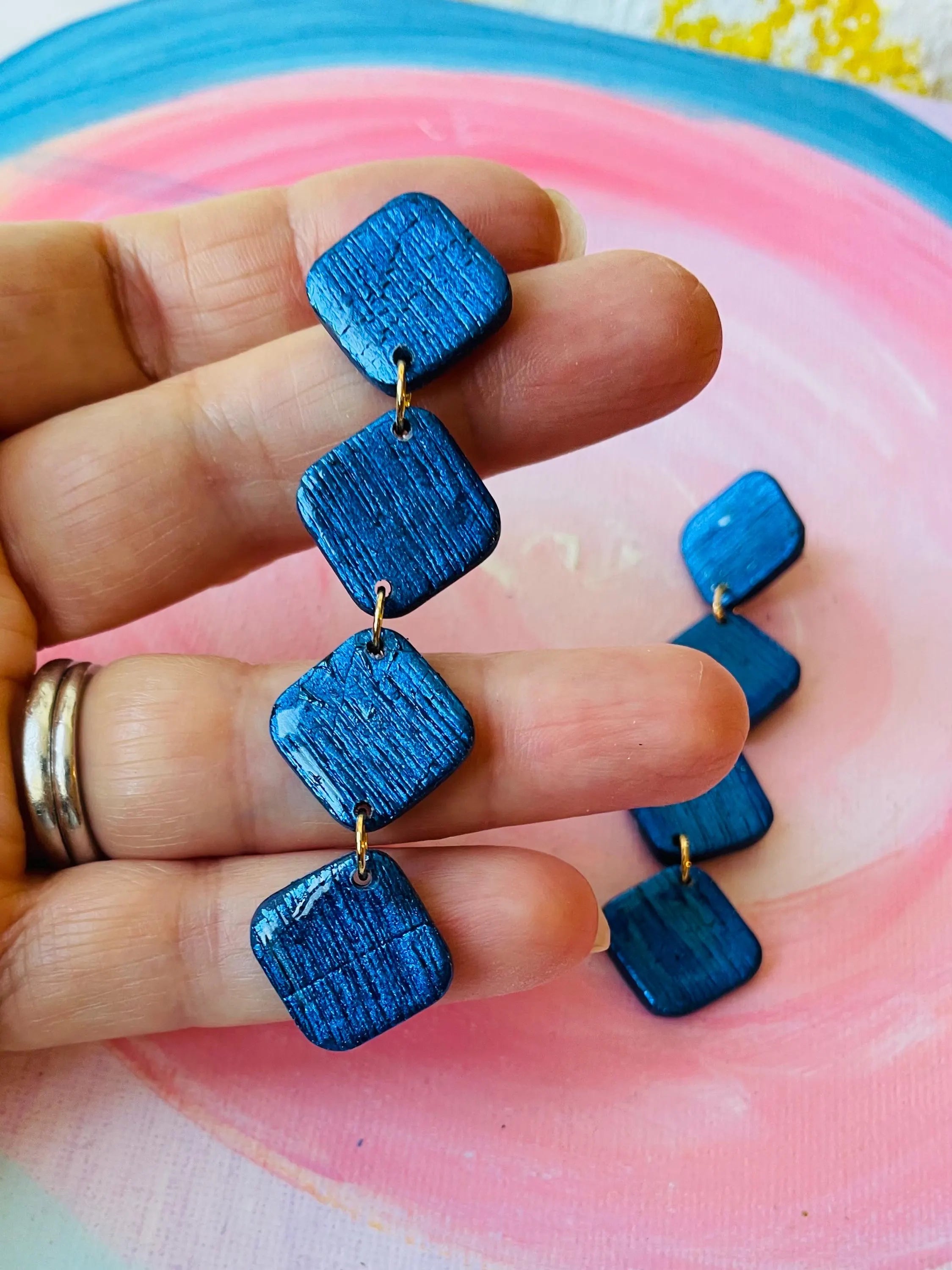 Unleash your inner fashionista with QUADRO - Blue geometric earrings! Elevate your style game at parties or in your everyday life. These one-of-a-kind earrings make for a unique and playful gift option too.&nbsp;

Made of polymer clay these earrings are very comfortable and as stylish or everyday as you want to style them. A beautiful royal navy blue is always easy to match and it's always appropriate.
My Sara Jewellery