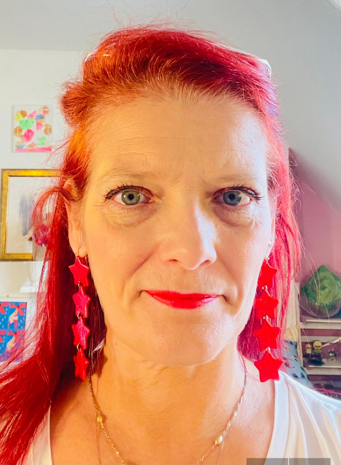 Elegant long red star earrings—perfect for a festive or romantic look. These earrings would make a fun gift for star lovers. Going to a festival this summer? Add some starry charm to your outfit with these light earrings.
These earrings are a true statement in a very bright red. The earrings have been worked with a roller to give them texture. This playful earrings would work as well with jeans or a party outfit. 