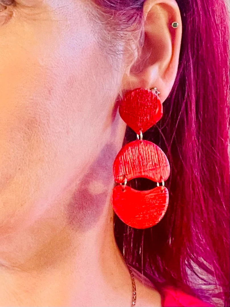 Enhance your appearance with our vibrant, bold statement earrings - an ideal choice for a birthday or special event gift. If you adore red, you will adore these red statement earrings! Handmade with polymer clay and red foil, these distinctive drop earrings feature a subtle striped texture that catches the light beautifully.
Stainless steel posts
3 cm width x 7 cm length
Lightweight
Handmade by me, each one is unique.
Custom colors available on request
Clip on backs available