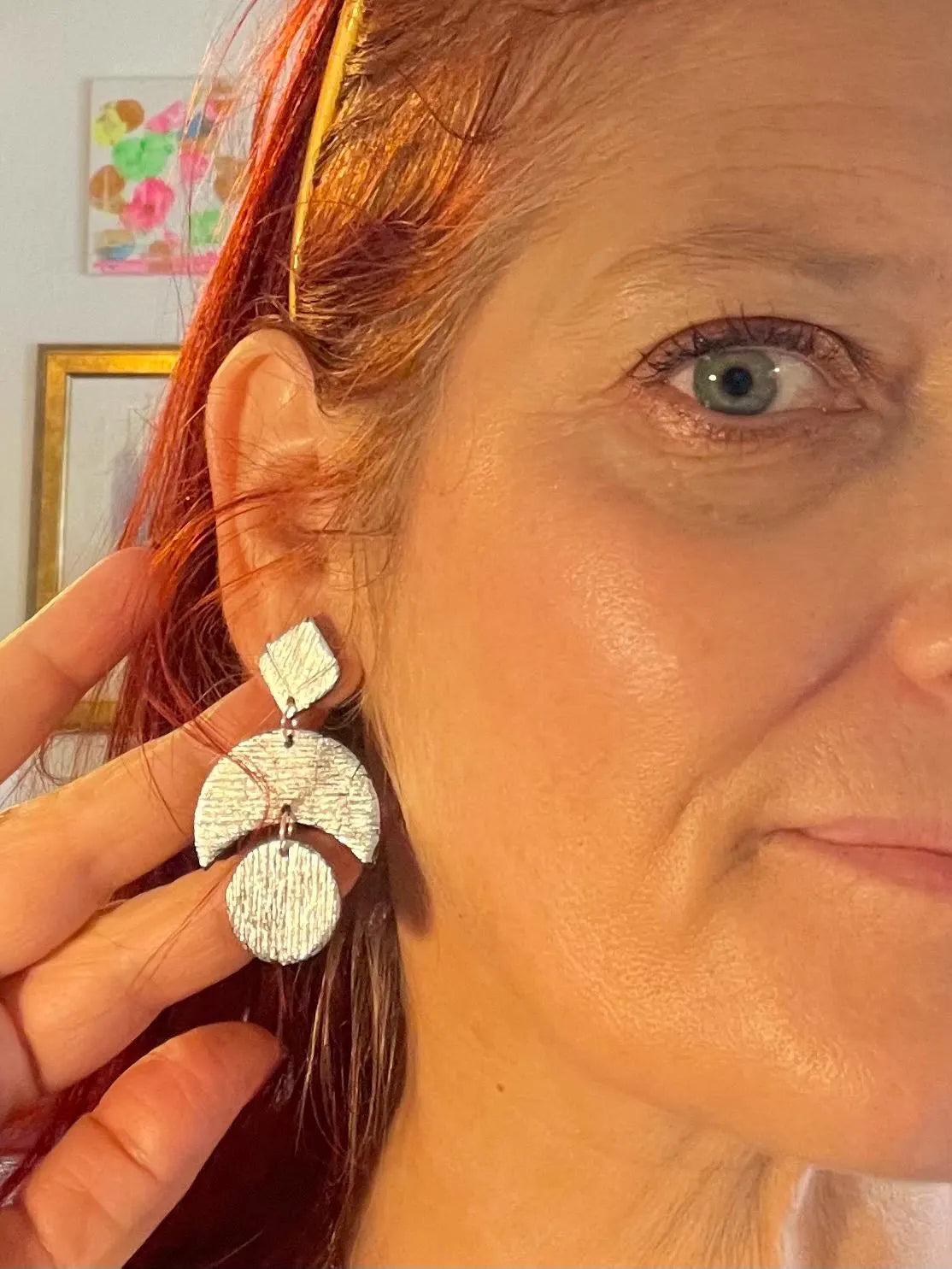 Add some sparkle to your wardrobe with these LUNA - Silver party earrings! Handcrafted and uniquely textured, these earrings are the perfect accessory for any occasion. Give them as a gift to a fellow moon lover (or keep them for yourself - we won't tell). Because let's be honest, who needs an excuse to treat themselves to something shiny? ;)