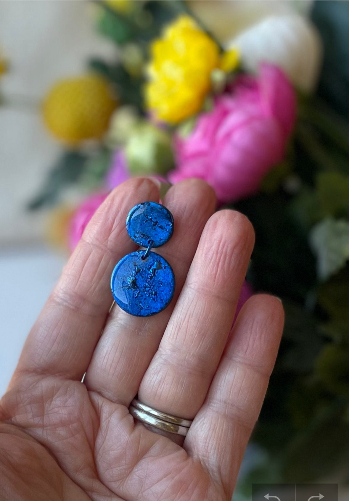 Crafted from vibrant blue polymer clay, these stunning earrings are named after the renowned Venetian island of Murano. Inspired by the island's colorful glass, these small earrings are available in a variety of bold shades, making them the perfect everyday accessory or thoughtful birthday gift.